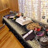 Fabric Champagne Gold Tablecloth - 9Ft X 5Ft (274Cm X 150Cm) - Black Gold Party Decoration - Graduation, Birthday, Anniversary, Promotion, New Year Eve Nye - Machine Washable - Reusable