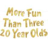 Gold glitter “More Fun Than Three 20-Year-Olds” banner for 60th birthday decor