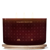 Jul 'Christmas' Scented Candle With 3 Wicks. Fragrance Notes: Baked Gingerbread, Winter Cloves And Spiced Oranges. 16.75 Oz.