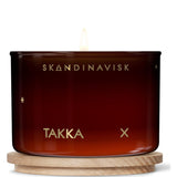 Takka 'Fireplace' Scented Candle. Fragrance Notes: Hacked Pine, Haysmoke And Raw Wool. Masculine Scent. 3.17 Oz.